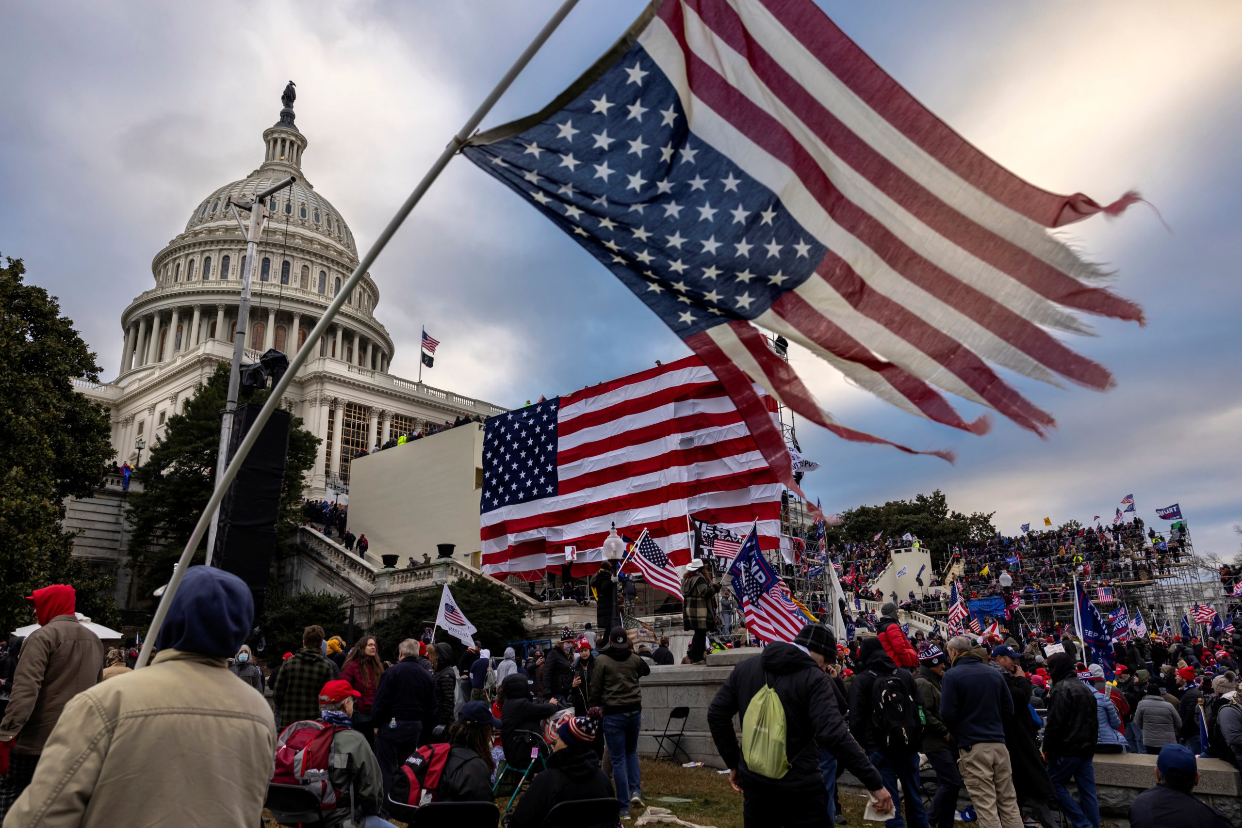 WASHINGTON, DC - JANUARY 6: Pro-Trump protesters gather in front of the U.S. Capitol Building on January 6, 2021 in Washington, DC. Trump supporters gathered in the nation's capital to protest the ratification of President-elect Joe Biden's Electoral College victory over President Trump in the 2020 election. A pro-Trump mob later stormed the Capitol, breaking windows and clashing with police officers. Five people died as a result. (Photo by Brent Stirton/Getty Images)