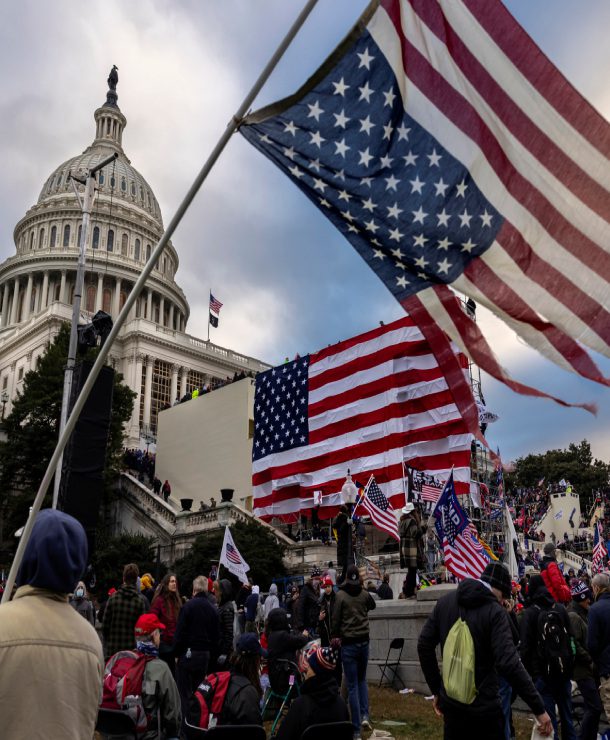 WASHINGTON, DC - JANUARY 6: Pro-Trump protesters gather in front of the U.S. Capitol Building on January 6, 2021 in Washington, DC. Trump supporters gathered in the nation's capital to protest the ratification of President-elect Joe Biden's Electoral College victory over President Trump in the 2020 election. A pro-Trump mob later stormed the Capitol, breaking windows and clashing with police officers. Five people died as a result. (Photo by Brent Stirton/Getty Images)